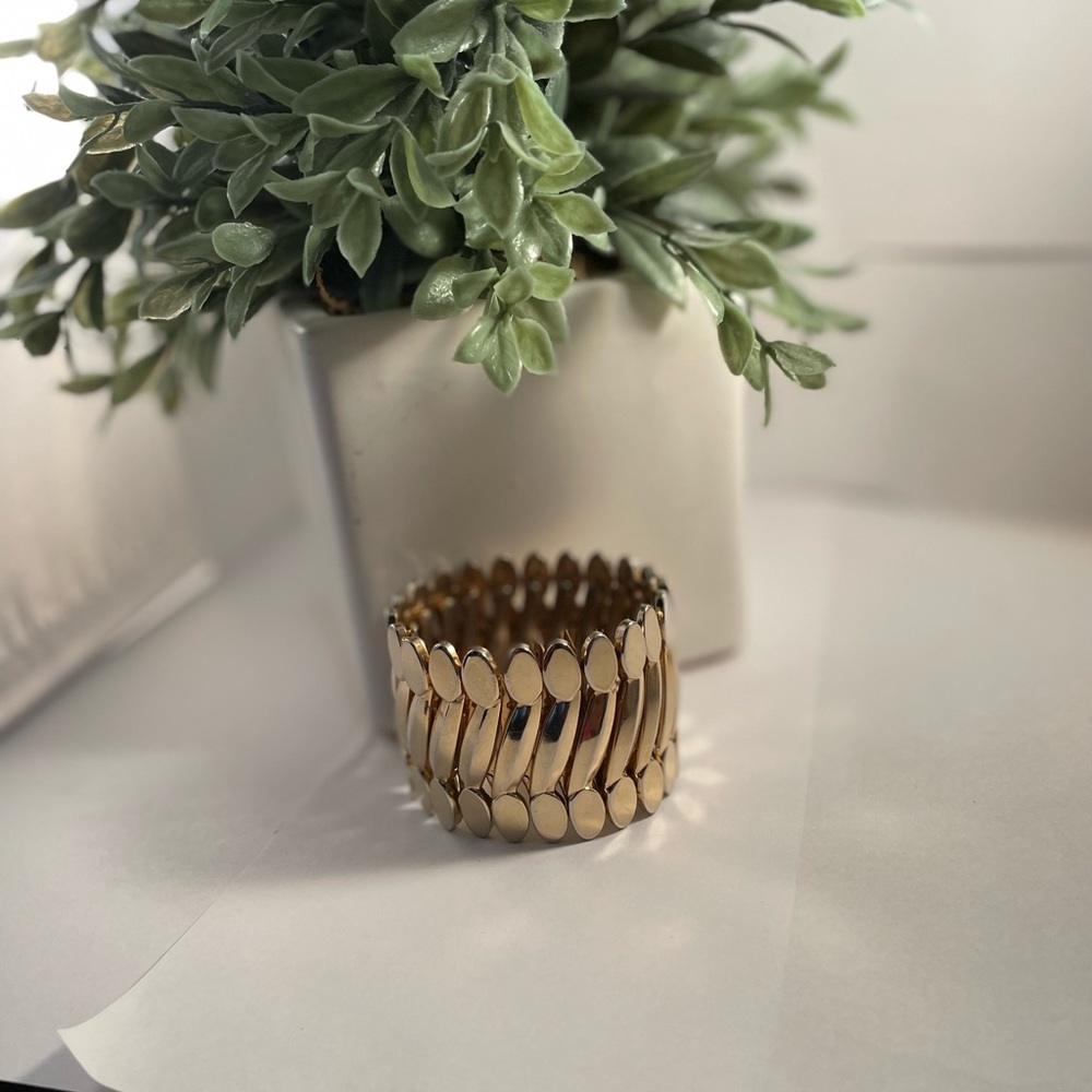 Gold tone stretch bracelet can fit large wrist